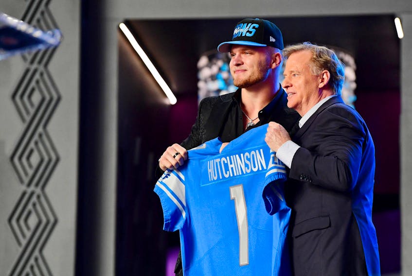 Detroit Lions draft pick Aidan Hutchinson poses with NFL commissioner Roger Goodell at Thursday night’s draft.