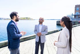 Saint Mary’s University researcher Dr. Ather Akbari (middle) with students from the Sobey School of Business on the Halifax waterfront, near the Canadian Museum of Immigration at Pier 21.