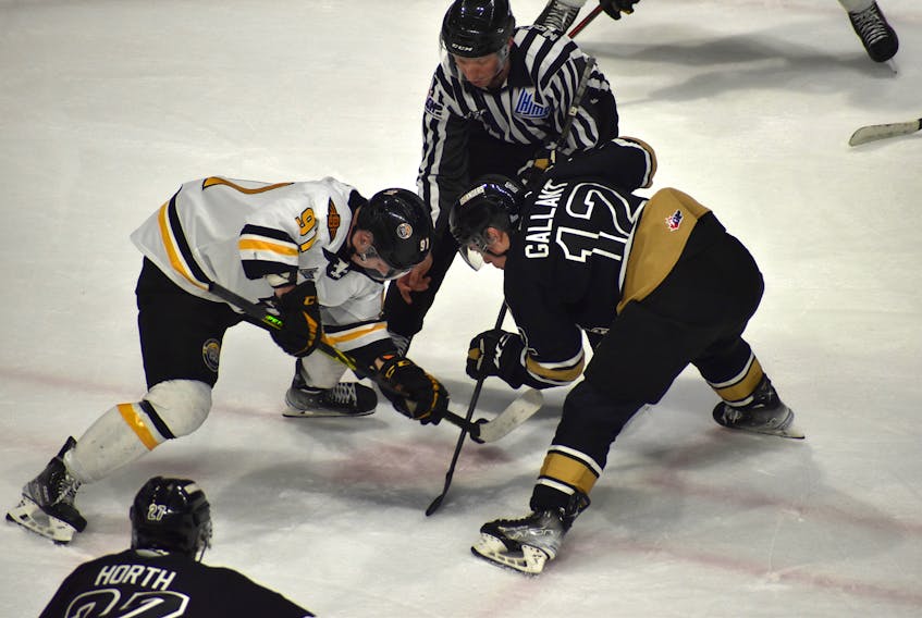 Kian Bell of the Cape Breton Eagles, left, battles at the faceoff with Keiran Gallant of the Charlottetown Islanders during Quebec Major Junior Hockey League action earlier this week at Centre 200 in Sydney. The Eagles will wrap up their season when they host the Halifax Mooseheads at 3 p.m. on Sunday. JEREMY FRASER/CAPE BRETON POST.