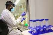  Dr. Femi Oloye prepares samples at the University of Saskatchewan’s wastewater testing facility on Sept. 30, 2021.