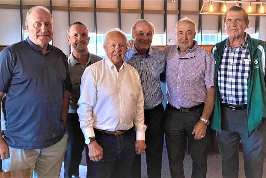 Former Montreal Canadiens’ great Guy Lafleur, third right, poses with former Canadiens, from left, Bob Gainey, Guy Carbonneau, Yvon Cournoyer, Guy LaFleur, Guy Lapointe and Serge Savard. The photo was taken during Lafleur’s 70th birthday party.