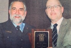 Rev. Bill Gibson received the Judy Fry Memorial Award in 2007 for his contributions to Windsor and the surrounding area. He was also Windsor’s provincial volunteer of the year recipient. Pictured presenting the award is Chris Fry.