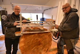 Cape Breton land developer Rolf Bouman, left, and west coast woodcarver Gerry Sheena in Sheena's workshop at Friends United in 2020. Bouman said he will discontinue the initiative in response to the province's new non-resident taxes. CONTRIBUTED