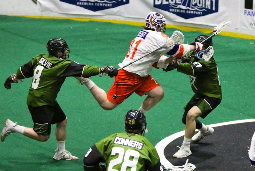 Halifax Thunderbirds' Chris Boushy leaps to score against the Rochester Knighthawks during National Lacrosse League action Saturday night in Rochester, N.Y. Halifax won 13-10. - NATIONAL LACROSSE LEAGUE