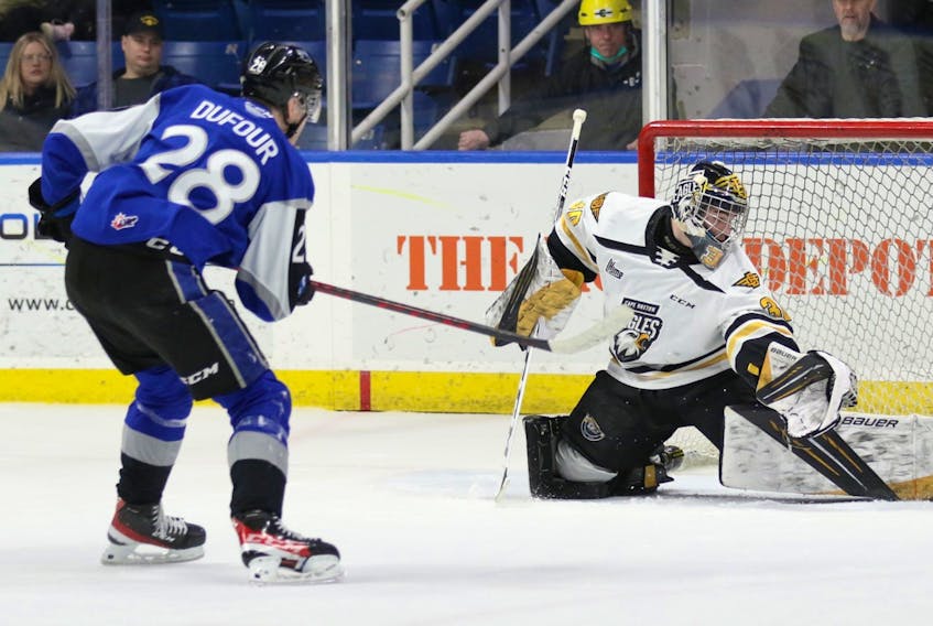 Remi Delafontaine of the Cape Breton Eagles, right, makes a save on William DuFour of the Saint John Sea Dogs during Quebec Major Junior Hockey League action at Centre 200 on Saturday. The Sea Dogs won the game 5-1. PHOTO CONTRIBUTED/MIKE SULLIVAN.