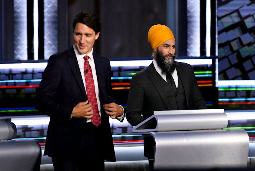 Liberal Leader Justin Trudeau and NDP Leader Jagmeet Singh take part in a federal election debate in Gatineau in 2021. Just over a year later, the two leaders formed an agreement to see the NDP support the Liberals until 2025. Canadians will get their first look at what that might mean with the April 7 federal budget. Justin Tang/Pool via REUTERS/File Photo