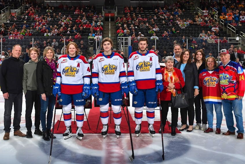 The Edmonton Oil Kings' three 20 year-old players, from centre left, Carter Souch, Josh Williams and Simon Kubicek, were honoured by the club ahead of Sunday's home game against the Red Deer Rebels. They will play their final regular-season game at Rogers Place in Saturday's rematch.