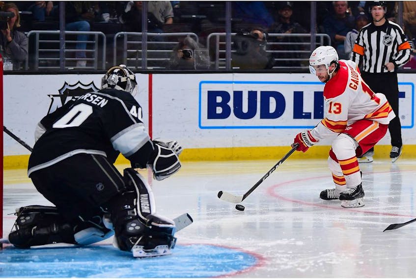 Apr 4, 2022; Los Angeles, California, USA; Calgary Flames left wing Johnny Gaudreau (13) moves in for a shot against Los Angeles Kings goaltender Cal Petersen (40) during the third period at Crypto.com Arena. 
