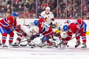 Montreal Canadiens, from left, Paul Byron, Christian Dvorak and Joel Armia get tied up with Ottawa Senators' Brady TTkachuk and Josh Norris on a face-off during second period of National Hockey League game in Montreal Tuesday, April 5, 2022.