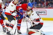 Ottawa Senators' Artem Zub pushes Montreal Canadiens' Mike Hoffman into goalie Anton Forsberg during first period of National Hockey League game in Montreal Tuesday, April 5, 2022.