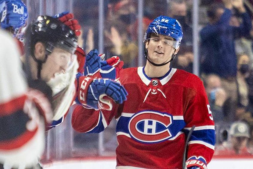 Montreal Canadiens' Justin Barron heads to the bench to celebrate his first career goal during second period of National Hockey League game against the Ottawa Senators  in Montreal Tuesday, April 5, 2022.
