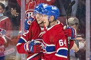 Montreal Canadiens' Justin Barron, left, celebrates his first career goal with teammate Corey Schueneman during second period of National Hockey League game against the Ottawa Senators  in Montreal Tuesday, April 5, 2022.