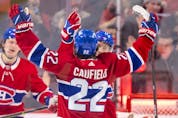 Montreal Canadiens' Brendan Gallagher celebrates with Cole Caufield after Caufield's goal against the Ottawa Senators during second period of National Hockey League game in Montreal Tuesday, April 5, 2022.