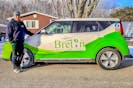 Erick Benner, owner of Breton Green Solutions, stands with his Kia Soul electric car in Sydney. He's had the vehicle for two months. CONTRIBUTED/Erick Benner