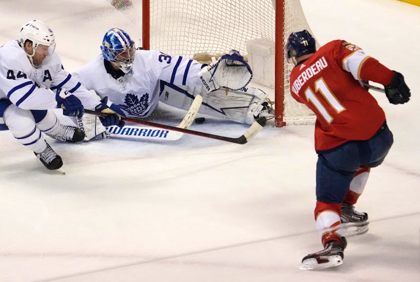 Florida Panthers left wing Jonathan Huberdeau (11) scores the game winning goal past Toronto Maple Leafs goaltender Jack Campbell (36) during the overtime period at FLA Live Arena. 
