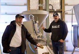 Mark Prevost, left, and Wally MacPhee, co-owners of Bait Masters Inc., started their business by using welded together barrels and a hand-cranked meat grinder. Now, they operate out of a $2-million facility in Nine Mile Creek. 