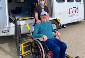 Jennifer White, director of therapeutic services at the Cove Guest Home, and resident B.J. Singler are seen alongside the local long-term care home’s new wheelchair-accessible bus. CONTRIBUTED