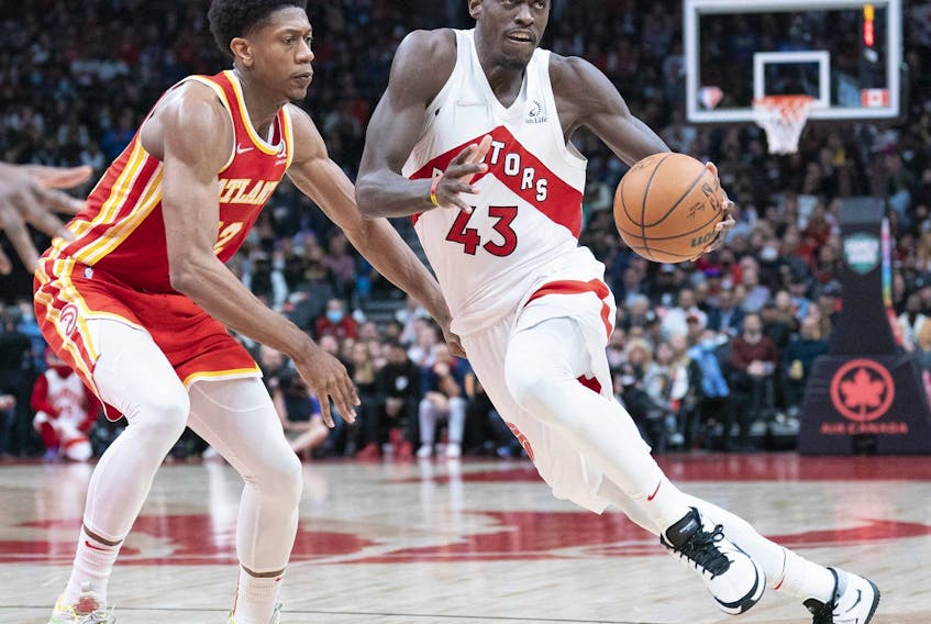 Toronto Raptors forward Pascal Siakam (43) controls the ball as Atlanta Hawks forward De'Andre Hunter (12) tries to defend during the fourth quarter at Scotiabank Arena.
