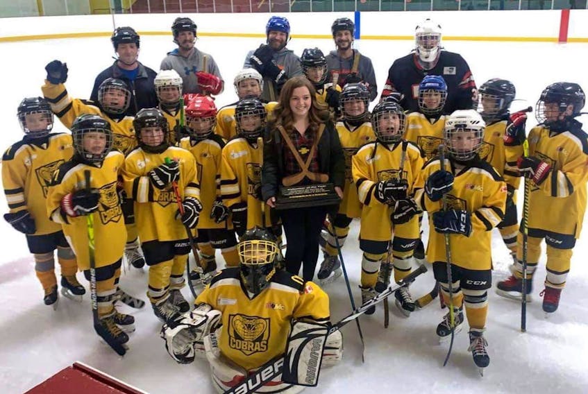 Brianna Burris holds the Cobra Spirit Trophy she recently received as the West Colchester Minor Hockey Association’s volunteer of the year. The trophy is named in honour of Jamie and Greg Blair, Lisa McCully, Heather O’Brien, Kristen and Baby Beaton. Contributed