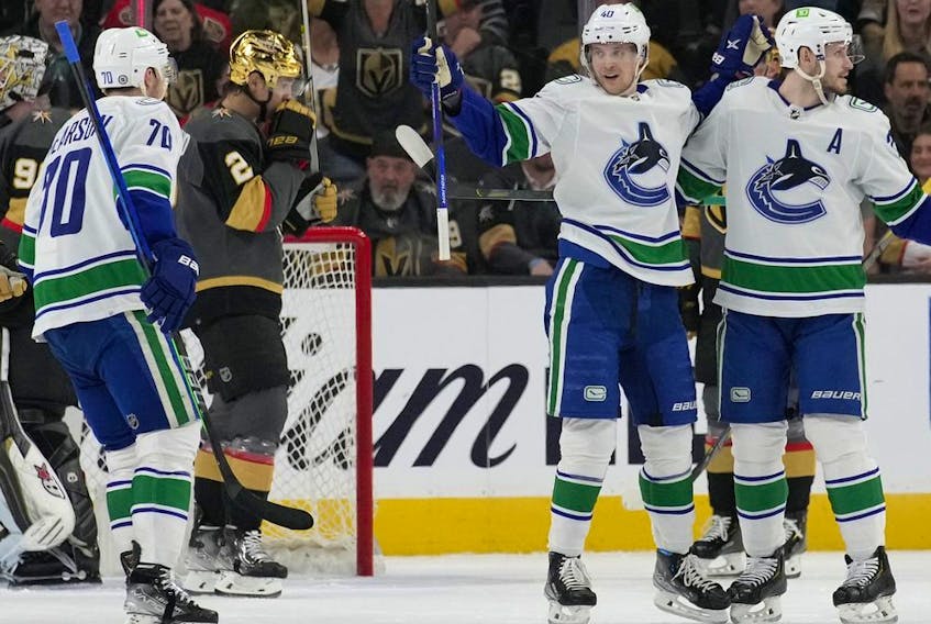  Vancouver Canucks centre Elias Pettersson, second from right, celebrates after scoring against the Vegas Golden Knights during the second period of an NHL hockey game Wednesday, April 6, 2022, in Las Vegas.