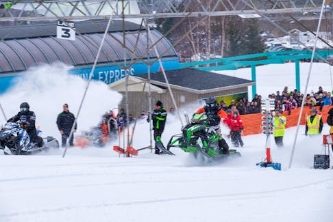 And they're off! A snowmobiler is seen here racing forward on an Arctic Cat during one of the previous editions of the Race on the Rock. CONTRIBUTED