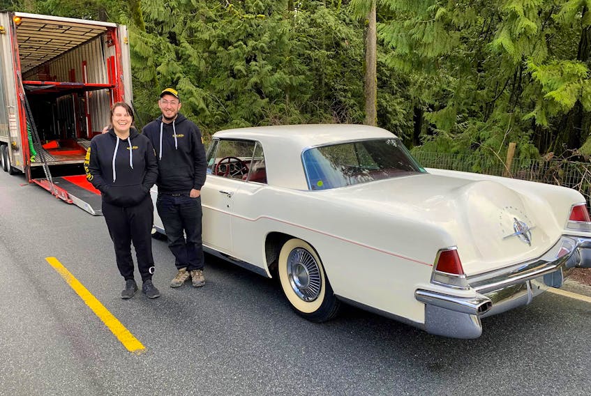 Christina Kelbert and Michael Bar about to load a 1956 Continental into their 80-foot-long car hauler for the trip from Vancouver to Toronto. Alyn Edwards/Postmedia News