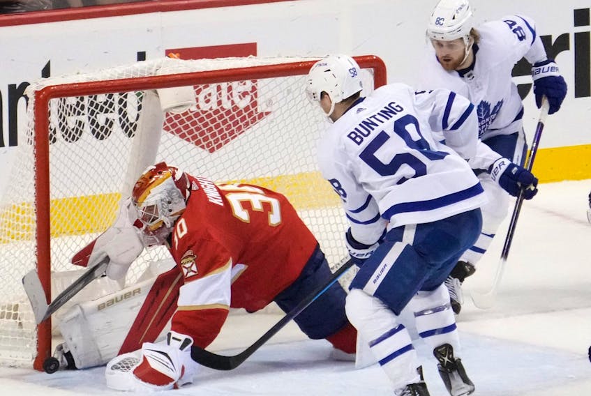 Panthers goaltender Spencer Knight (30) blocks the shot of Toronto Maple Leafs left wing Michael Bunting. 
