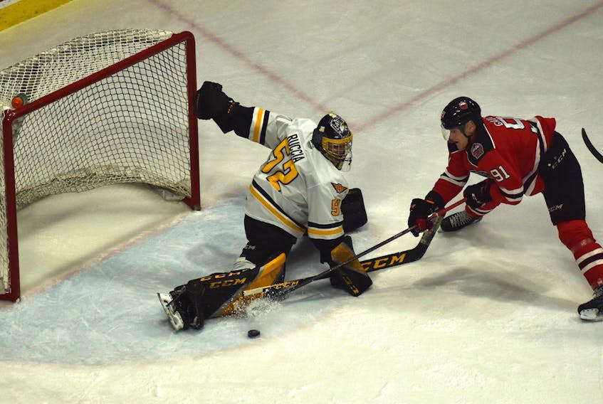Cape Breton Eagles goaltender Nicolas Ruccia, left, makes a big right pad save on Nathan Gaucher of the Quebec Remparts during Quebec Major Junior Hockey League action at Centre 200 on Thursday. Quebec won the game 6-3. JEREMY FRASER/CAPE BRETON POST.