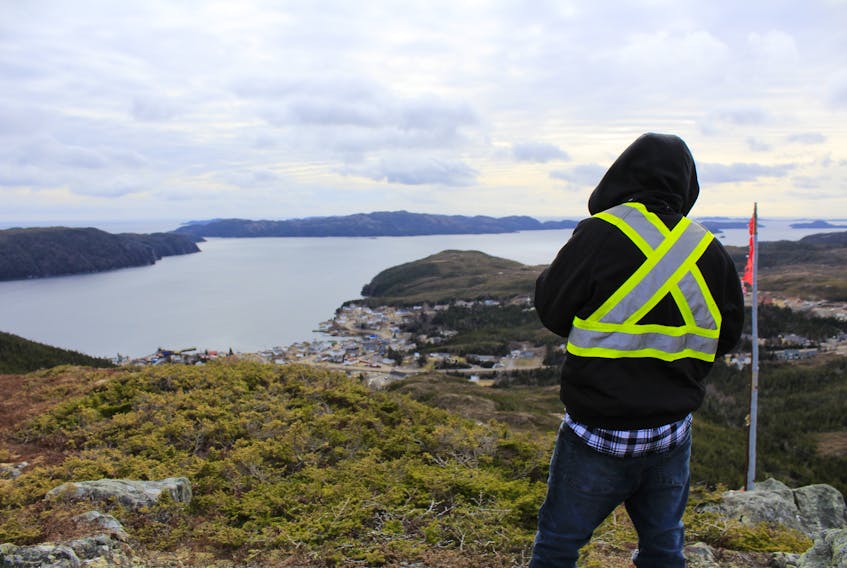 Howie Hynes stands atop the Crown au Buck trail near Parker's Cove on the Burin Peninsula. Hynes and his brother led the effort to clean up the old wilderness trail leading to the summit. 