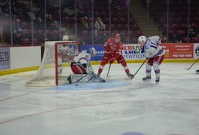 Fredericton Red Wings forward Declan MacEachern, 12, of Charlottetown has a close-in scoring opportunity against the Summerside D. Alex MacDonald Ford Western Capitals in a Maritime Junior Hockey League (MHL) regular-season game in Summerside on Dec. 16. Caps forward Thomas Lacombe, 11, supports goaltender Felix-Anthony Ethier