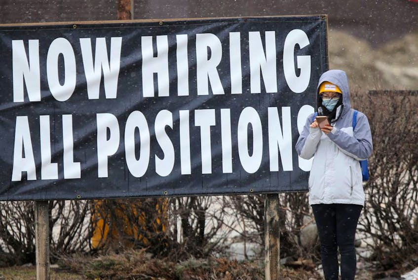A sign advertising hiring in all positions is seen in Winnipeg. The unemployment rate in Canada hasn't been this low since 1976. 