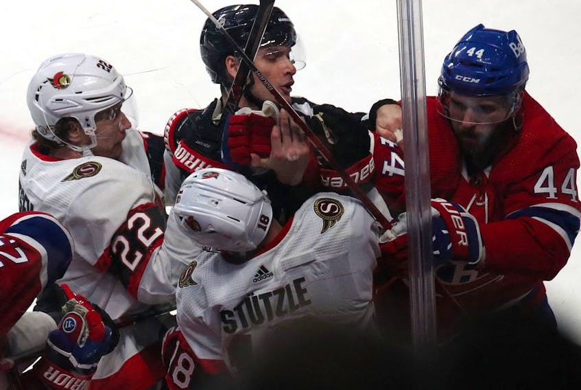 Tim Stuetzle is right in the middle of things as Ottawa Senators and Montreal Canadiens players jostle during the third period at the Bell Centre on Tuesday night.