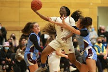 Citadel Phoenix Mercy Olugu lays one up in front of Armbrae Academy's LaNazia Jordan during SNS division 1 provincials at Ciadel Friday April 8, 2022.

TIM KROCHAK PHOTO