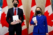  Prime Minister Justin Trudeau and Finance Minister Chrystia Freeland pose for a picture holding the 2022-23 budget.