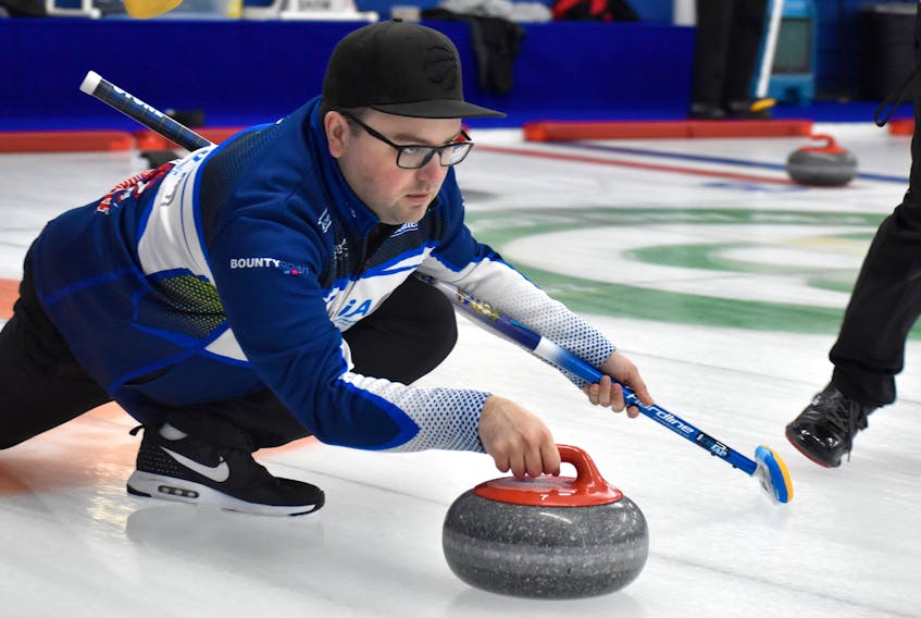 Travis Stone of the Sydney Curling Club focuses on his shot during Mercer Fuels Cash Spiel game action at the Sydney Curling Club on Friday. Stone's team defeated Team Benito DeLorenzo in the contest, but the official score was not provided. JEREMY FRASER/CAPE BRETON POST.
