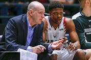  Former head coach Dave Smart chats with Alain Louis on the bench as the Carleton Ravens during the quarter finals of the 2020 U SPORTS Final 8 Championships at TD Place in Ottawa. Wayne Cuddington/ Postmedia