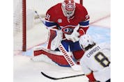 Canadiens goaltender Carey Price makes a save off of Ben Chiarot of the Florida Panthers in the second period  at the Bell Centre in Montreal on Friday, April 29, 2022. It was the last game of the season for the Canadiens. 