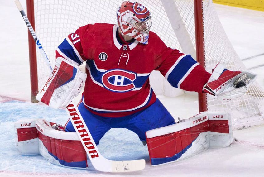  Canadiens goaltender Carey Price gloves the puck against the Florida Panthers in Montreal on Friday, April 29, 2022.