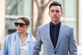 Canadian musician Jacob Hoggard arrives alongside his wife Rebekah Asselstine, for his sex assault trial at the Toronto courthouse on Tuesday, May 10, 2022 in Toronto. 