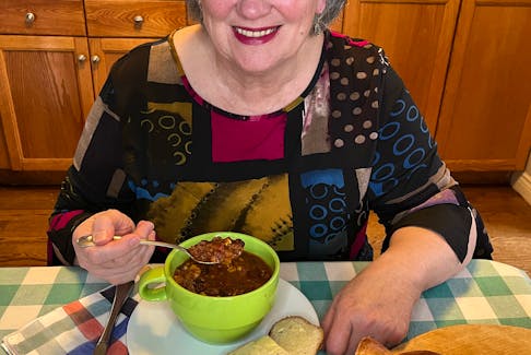 Mary Janet MacDonald with a bowl of her sweet and easy chili. The Cape Breton woman says a pot of chili is a great way to serve a crowd cheaply, but it's also a good item an individual can prepare and freeze for later.