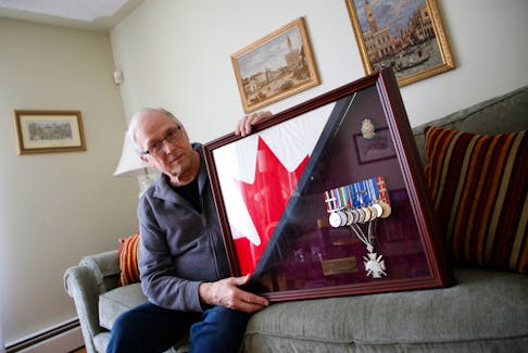 FOR SCHNEIDEREIT STORY:
Retired Canadian military veteran Tim Dunne is seen with a shadow box with some of his military medals, including a Bulgarian Cross in his Dartmouth home April 22, 2022.