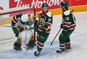 Halifax Mooseheads players console goalie Mathis Rousseau following the Acadie-Bathurst Titans 4th goal of the the 1st period during QMJHL playoff action in Halifax Monday May 9, 2022. The Titan went on to win, 8-1.

TIM KROCHAK PHOTO