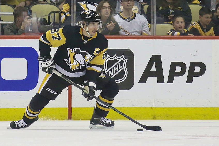 May 9, 2022; Pittsburgh, Pennsylvania, USA;   Pittsburgh Penguins center Sidney Crosby (87) handles the puck against the New York Rangers during the first period in game four of the first round of the 2022 Stanley Cup Playoffs at PPG Paints Arena. Mandatory Credit: Charles LeClaire-USA TODAY Sports  Pittsburgh Penguins centre Sidney Crosby handles the puck against the New York Rangers during the first period of Game 4 of the first round of the 2022 Stanley Cup Playoffs at PPG Paints Arena in Pittsburgh. - Charles LeClaire-USA TODAY Sports