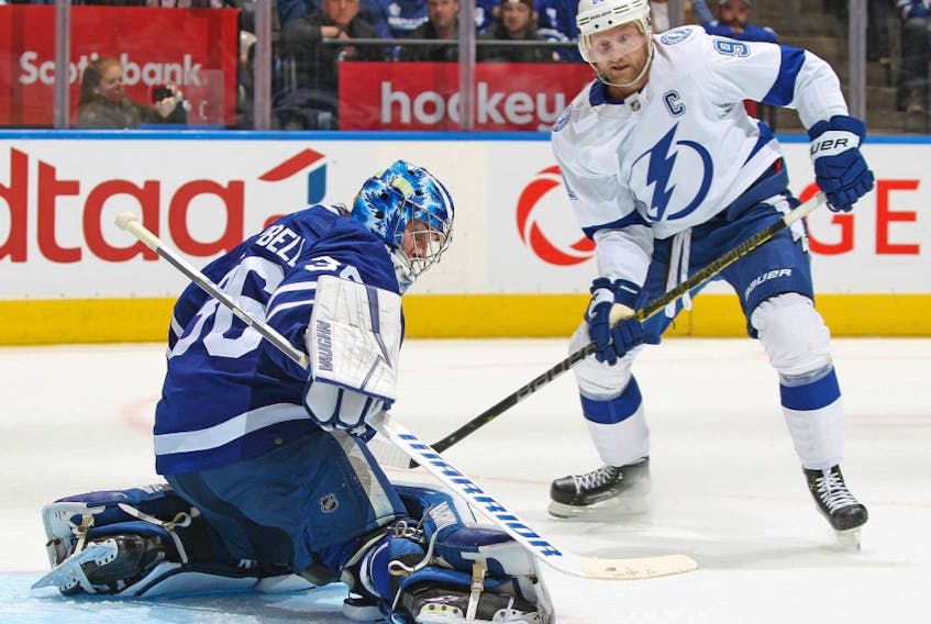 Jack Campbell of the Toronto Maple Leafs makes a save as Steven Stamkos of the Tampa Bay Lightning looks for a rebound during Game 5 of the First Round of the 2022 Stanley Cup Playoffs at Scotiabank Arena on May 10, 2022 in Toronto.


