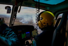Pilot Ardel Smith observes smoke rising from the wildfire near Horseshoe Lake, Yarmouth County. DEPARTMENT OF NATURAL RESOURCES AND RENEWABLES
