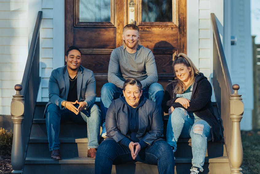 Mandy Rennehan pictured with trades apprentices Jaymin Luces-Mendes, Dan Croft and Melissa Chenell, during the filming of the HGTV Canada series Trading Up in Yarmouth, NS. PHOTO COURTESY HGTV CANADA