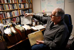 FOR SCHNEIDEREIT STORY:
Retired Canadian military veteran Tim Dunne is seen with some of the documents related to his military career in the basement office of his  Dartmouth home April 22, 2022.