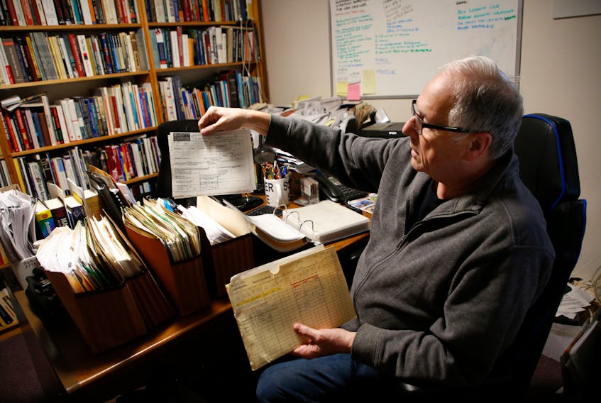 FOR SCHNEIDEREIT STORY:
Retired Canadian military veteran Tim Dunne is seen with some of the documents related to his military career in the basement office of his  Dartmouth home April 22, 2022.
