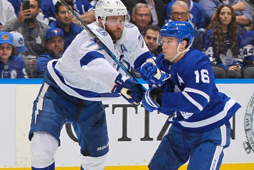 Lightning defenceman Victor Hedman, left, battles against Maple Leafs forward Mitch Marner during Game 5 of the first round of the 2022 Stanley Cup Playoffs at Scotiabank Arena in Toronto, Tuesday, May 10, 2022.