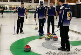 Lead Scott Weagle, from left,  third Joel Krats, second Adam MacEachern and skip Owen Purcell discuss strategy  during the final of the Canadian junior qualifying event last year. The Purcell rink opens play at the world junior championship in Jonkoping, Sweden, on Sunday against the United States. – Curling Canada
